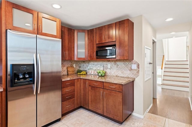 804 N Juanita Ave Unit B, Redondo Beach, CA 90277 - kitchen featuring recessed lighting, glass insert cabinets, light stone countertops, tasteful backsplash, and appliances with stainless steel finishes