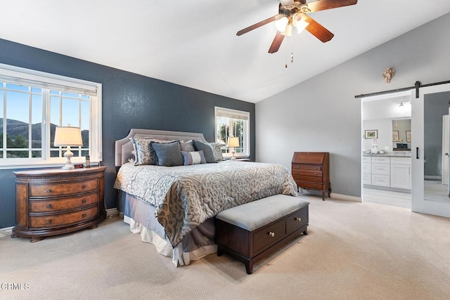 1894 Rambling Rd, Simi Valley, CA 93065 - bedroom featuring a barn door, lofted ceiling, light colored carpet, ensuite bath, and a ceiling fan