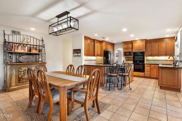 1894 Rambling Rd, Simi Valley, CA 93065 - dining space with light tile patterned flooring, recessed lighting, and arched walkways