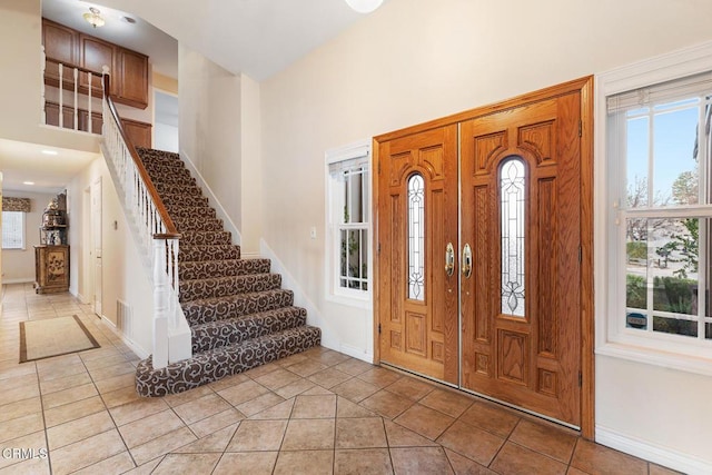 1894 Rambling Rd, Simi Valley, CA 93065 - foyer with a towering ceiling, light tile patterned floors, and stairway
