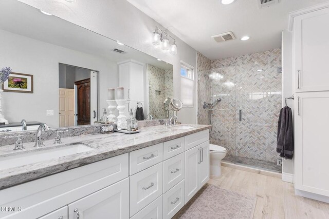 1894 Rambling Rd, Simi Valley, CA 93065 - full bathroom with double vanity, a stall shower, wood finished floors, and recessed lighting