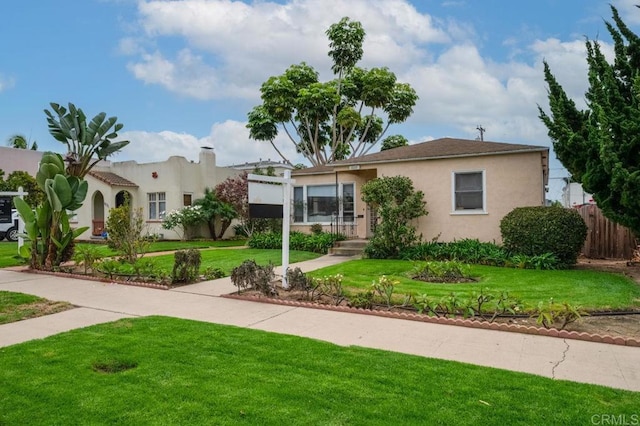 1025 Wilbur Ave, Pacific Beach San Diego, CA 92109 - view of front of home featuring fence, a front yard, and stucco siding
