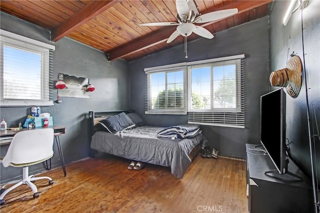 bedroom with wooden ceiling, lofted ceiling with beams, and wood finished floors