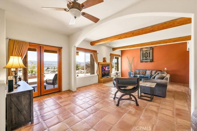 57710 Bandera Rd, Yucca Valley, CA 92284 - living area with ceiling fan, beamed ceiling, arched walkways, and french doors