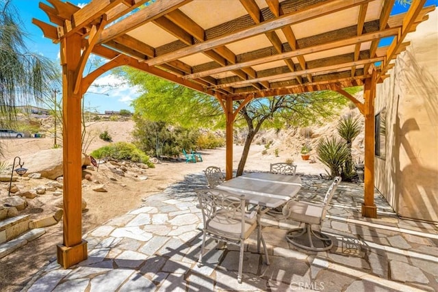 57710 Bandera Rd, Yucca Valley, CA 92284 - view of patio / terrace featuring outdoor dining area and a pergola