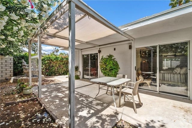 view of patio featuring a pergola and outdoor dining space