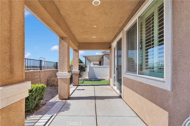 view of patio / terrace featuring fence