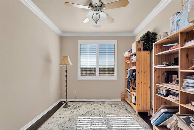 interior space featuring dark wood-type flooring, visible vents, crown molding, and ceiling fan