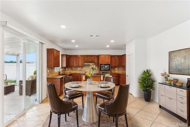 dining room with recessed lighting, visible vents, and light tile patterned floors