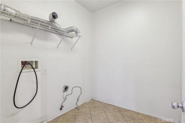 clothes washing area with light tile patterned flooring, hookup for a gas dryer, hookup for a washing machine, and laundry area