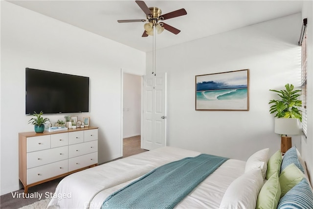 carpeted bedroom with a ceiling fan