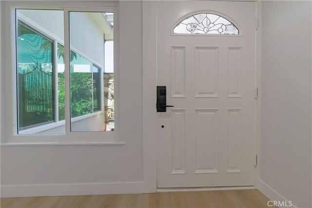 1080 Alta Loma Dr, Corona, CA 92882 - foyer with plenty of natural light, baseboards, and wood finished floors