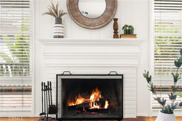 details with a lit fireplace