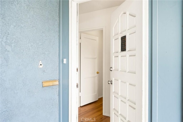 hall with light wood-type flooring