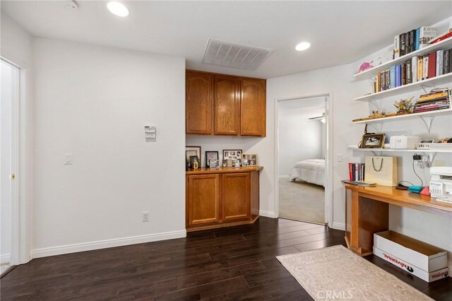 interior space featuring open shelves, brown cabinets, dark wood-type flooring, visible vents, and recessed lighting