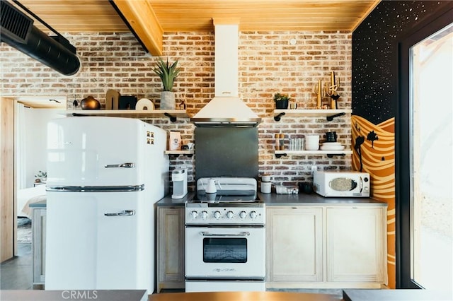 kitchen with white appliances, wooden ceiling, open shelves, and brick wall