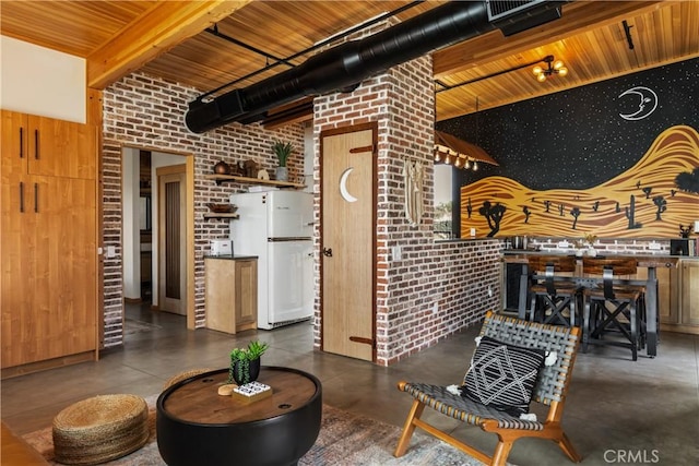 living room with brick wall, wooden ceiling, finished concrete floors, a high ceiling, and beam ceiling