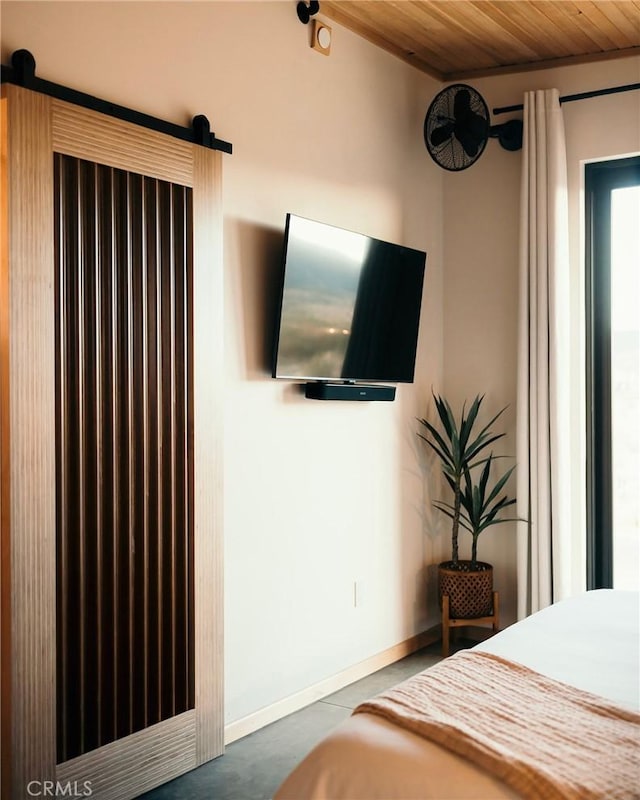 bedroom featuring wooden ceiling and baseboards