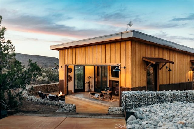 exterior entry at dusk with a mountain view