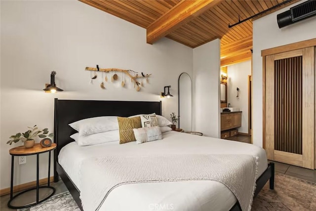 bedroom featuring wood ceiling and beamed ceiling