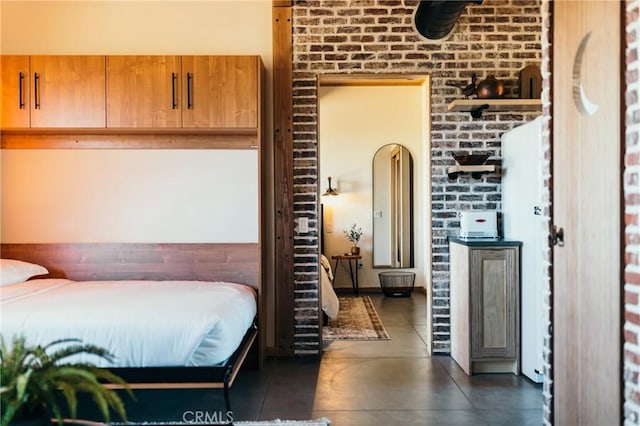 bedroom featuring concrete floors