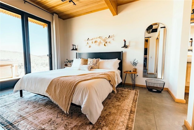 bedroom featuring wooden ceiling, multiple windows, baseboards, beam ceiling, and arched walkways