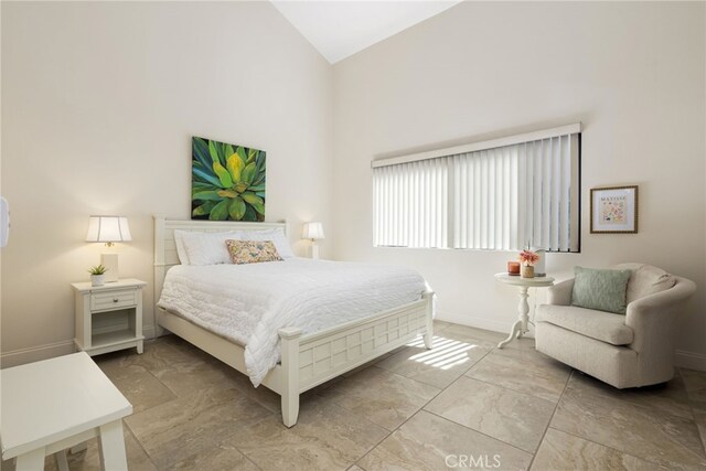 283 Wild Horse Dr, Palm Desert, CA 92211 - bedroom with high vaulted ceiling and baseboards