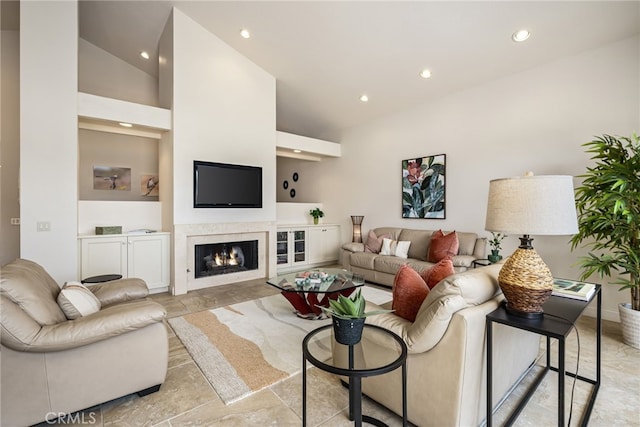 283 Wild Horse Dr, Palm Desert, CA 92211 - living room with a high end fireplace, vaulted ceiling, and recessed lighting