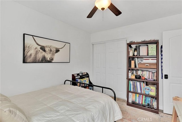 bedroom featuring a ceiling fan and a closet