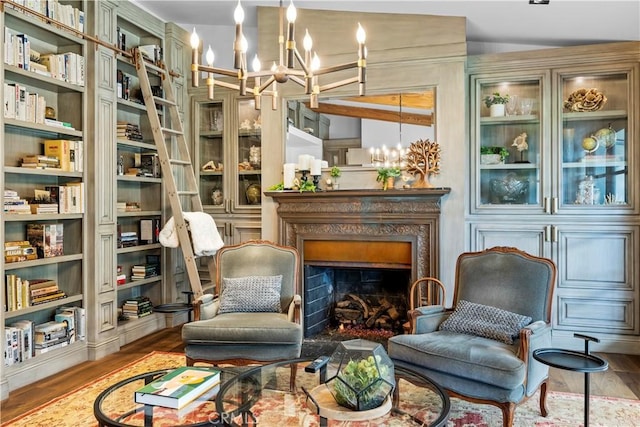 14 Chuckwagon Rd, Rolling Hills, CA 90274 - living area with an inviting chandelier, wood finished floors, and a fireplace