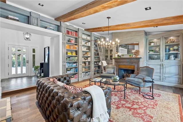 14 Chuckwagon Rd, Rolling Hills, CA 90274 - living room featuring beamed ceiling, a fireplace, an inviting chandelier, and wood finished floors