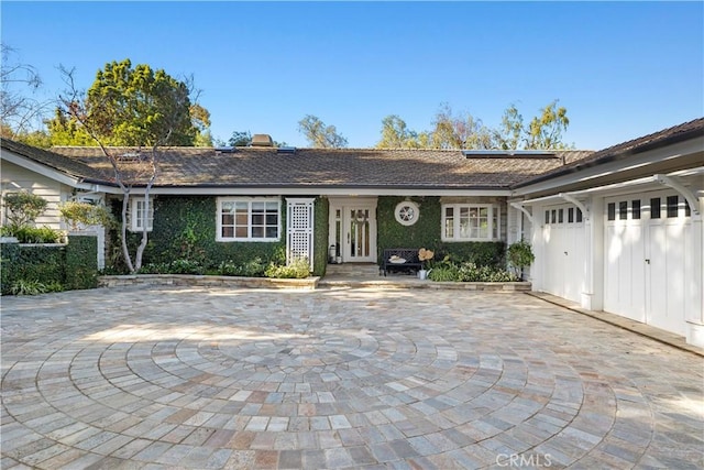 14 Chuckwagon Rd, Rolling Hills, CA 90274 - ranch-style house featuring an attached garage, roof mounted solar panels, and a chimney
