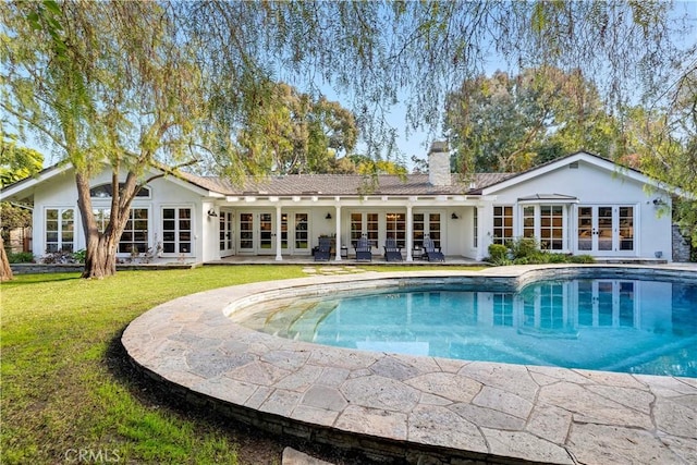 14 Chuckwagon Rd, Rolling Hills, CA 90274 - rear view of property featuring a yard, french doors, a chimney, and an outdoor pool