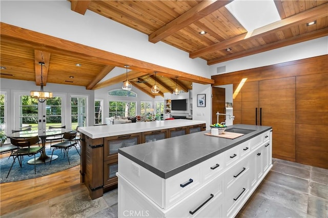 14 Chuckwagon Rd, Rolling Hills, CA 90274 - kitchen with wooden ceiling, a spacious island, hanging light fixtures, open floor plan, and vaulted ceiling with beams