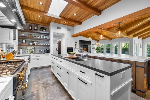 14 Chuckwagon Rd, Rolling Hills, CA 90274 - kitchen with a large island, beamed ceiling, ventilation hood, and wood ceiling