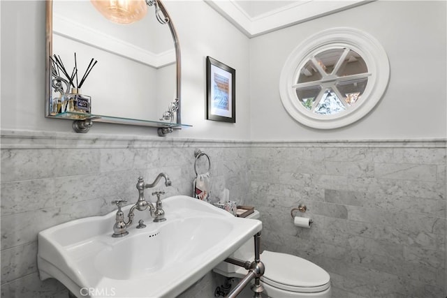 14 Chuckwagon Rd, Rolling Hills, CA 90274 - bathroom with wainscoting, tile walls, a sink, and toilet