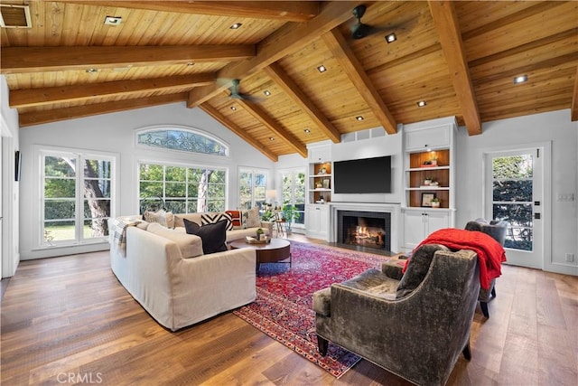 14 Chuckwagon Rd, Rolling Hills, CA 90274 - living area featuring wooden ceiling, visible vents, a fireplace with flush hearth, wood finished floors, and lofted ceiling with beams