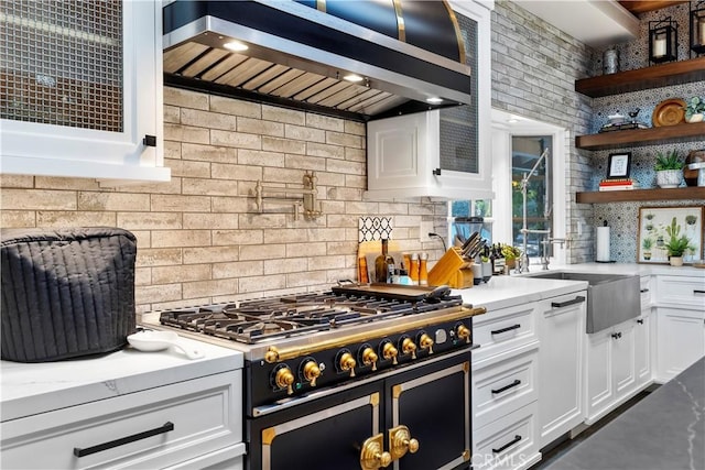 14 Chuckwagon Rd, Rolling Hills, CA 90274 - kitchen with range with two ovens, a sink, white cabinetry, open shelves, and wall chimney range hood