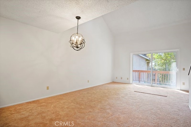 7050 Shoup Ave Unit 173, Canoga Park, CA 91303 - empty room with carpet flooring, a textured ceiling, a notable chandelier, and high vaulted ceiling