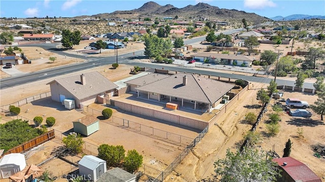 birds eye view of property with a mountain view and a residential view