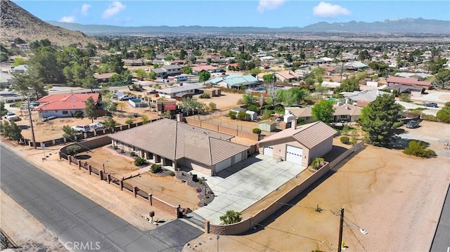 drone / aerial view with a residential view and a mountain view