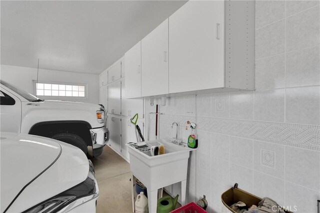 laundry area with cabinet space