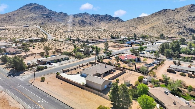 drone / aerial view featuring a residential view and a mountain view