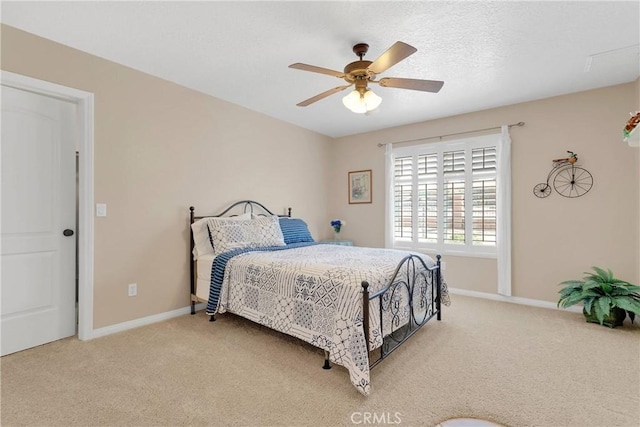bedroom with baseboards, carpet flooring, and ceiling fan