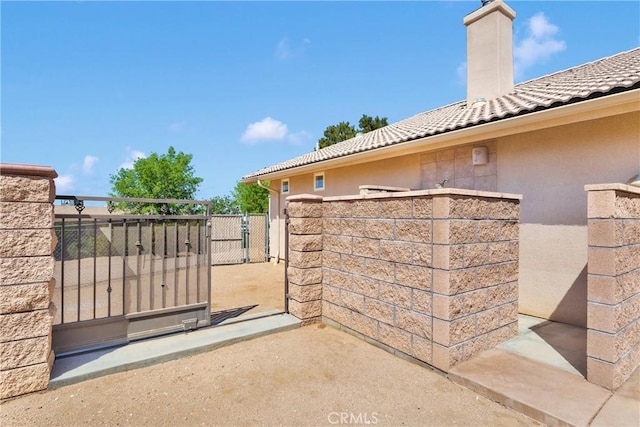 view of gate featuring fence