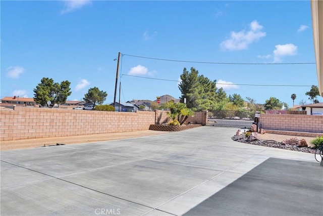view of patio / terrace featuring a gate and fence