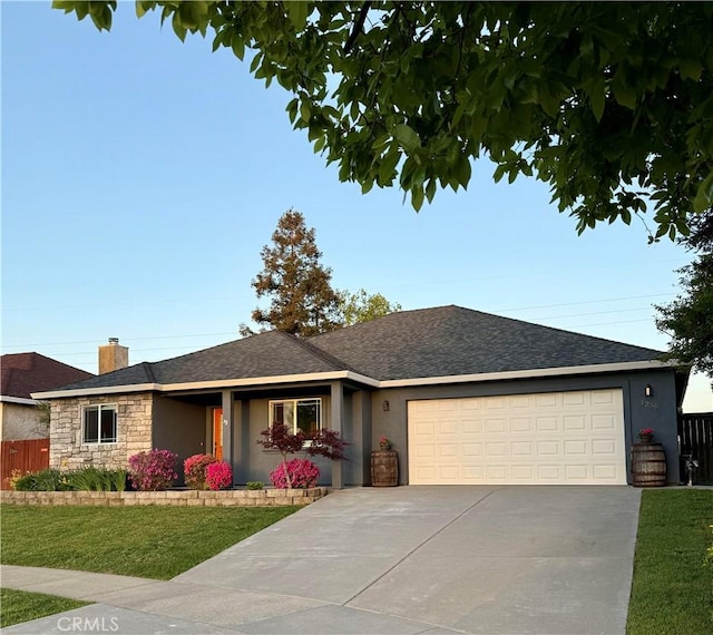 single story home featuring driveway, a front yard, and stucco siding
