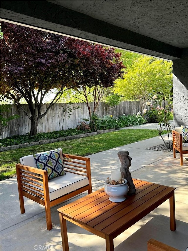 view of patio with outdoor lounge area and a fenced backyard