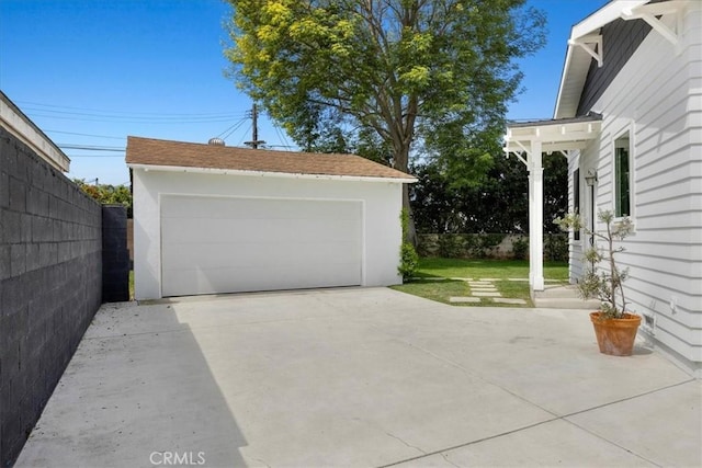 detached garage with fence