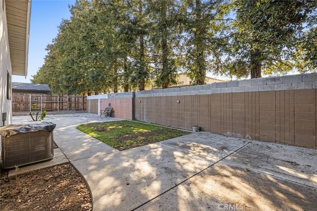 view of patio / terrace with a fenced backyard and central AC unit